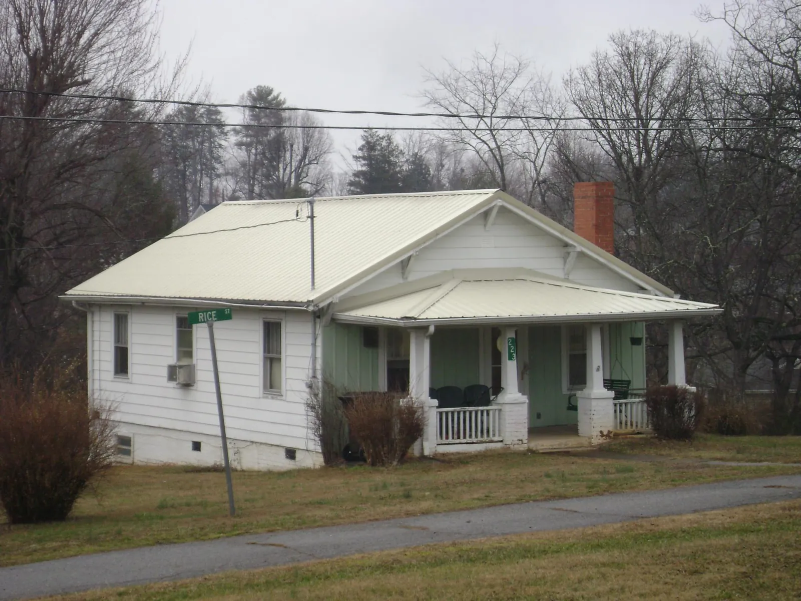 White metal roof on a craftsman bungalow at a street corner in Everetts